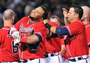 The Atlanta Braves Juan Francisco, second from left, is surrounded by teammates to celebrate his game-winning RBI single against the Los Angeles Dodgers in the 11th inning at Turner Field in Atlanta, Georgia, on Friday, August 17, 2012. (Hyosub Shin/Atlanta Journal-Constitution/MCT)