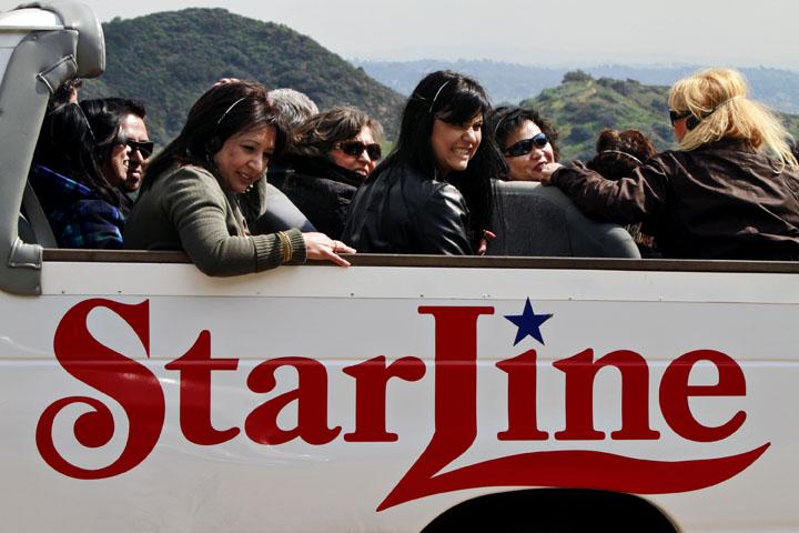A+Starline+Tour+bus+is+tourist-laden+in+Los+Angeles%2C+California%2C+on+February+23%2C+2011.+The+booming+business+is%2C+among+other+ventures%2C+teaming+up+with+the+celebrity+news+source+TMZ+to+create+a+guided+tour+that+cruises+past+the+sites+where+TMZ+has+reported+its+biggest+celebrity+scoops.+%28Liz+O.+Baylen%2FLos+Angeles+Times%2FMCT%29