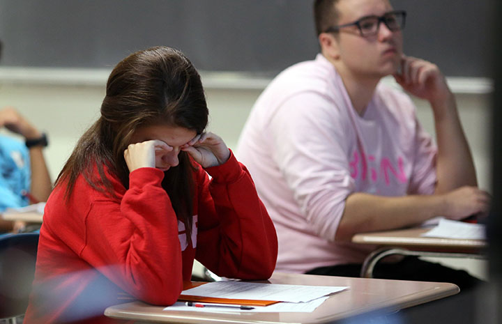 Michelle Pindrik, a junior, rubs her face to stay awake during teacher Rich Schrams eighth period honors physics class Aug. 28, 2014 at Buffalo Grove High School in Buffalo Grove, Ill. The American Academy of Pediatrics issued a statement saying school start times should be pushed to 8:30 a.m. or later, as many students arent getting enough sleep. (Brian Cassella/Chicago Tribune/MCT)