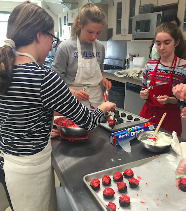 Members of the Soup Kitchen Club, making treats for a local soup kitchen. 