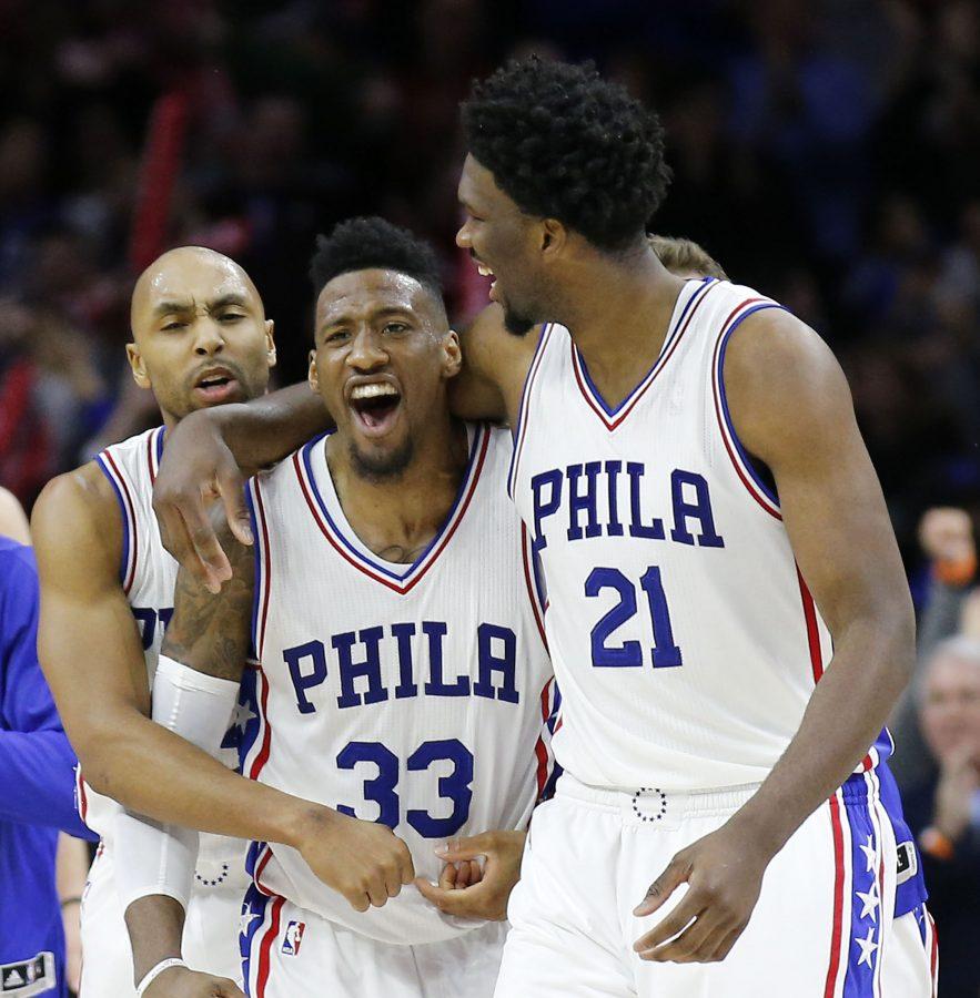 The Philadelphia 76ers' Robert Covington (33) celebrates with teammates Joel Embiid (21) and Gerald Henderson after a 93-92 win against the Portland Trail Blazers on Friday, Jan. 20, 2017, at the Wells Fargo Center in Philadelphia. (Yong Kim/Philadelphia Daily News/TNS)