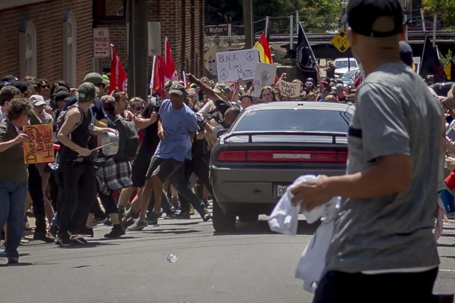 On Saturday, Aug. 12, 2017, white supremacist groups clashed with hundreds of counter-protesters during the Unite The Right rally in Charlottesville, Va. Dozens were injured in skirmishes and many others after a white nationalist plowed his sports car into a throng of protesters. One counter-protester died after being struck by the vehicle. The driver of the car was caught fleeing the scene and the governor of Virginia issued a state of emergency. (Michael Nigro/Pacific Press/Zuma Press/TNS)