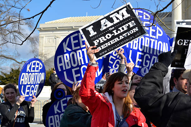 Washington D.C., USA - January 22, 2015; A Pro-Life woman clashes with a group of Pro-Choice demonstrators at the U.S. Supreme Court.